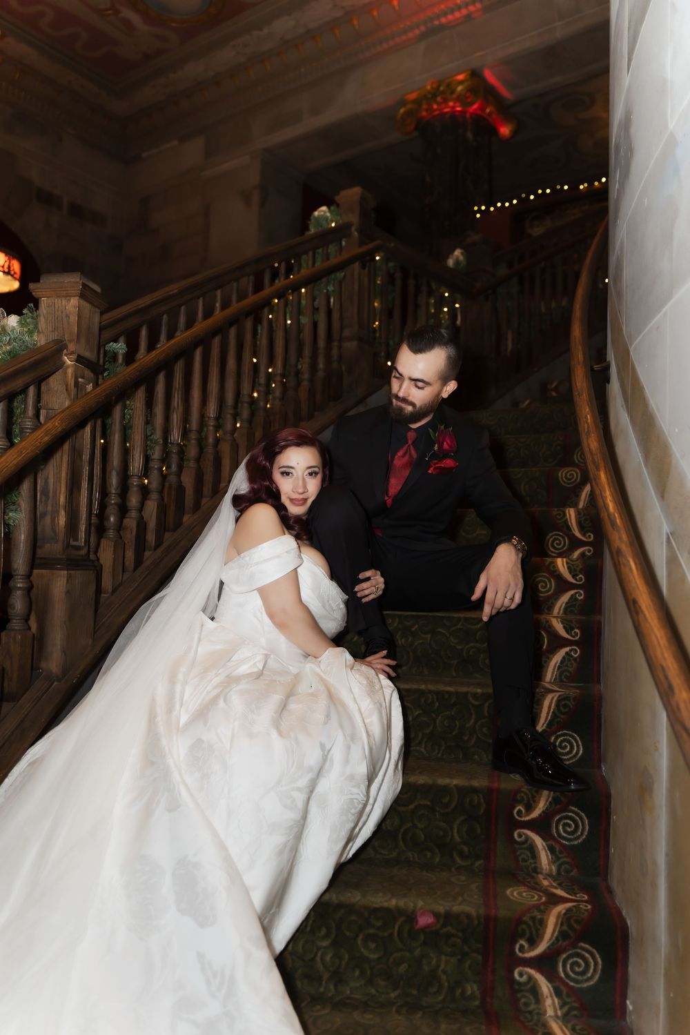 Bride and groom portrait on the grand staircase at The Society Room wedding venue in Hartford, Connecticut.