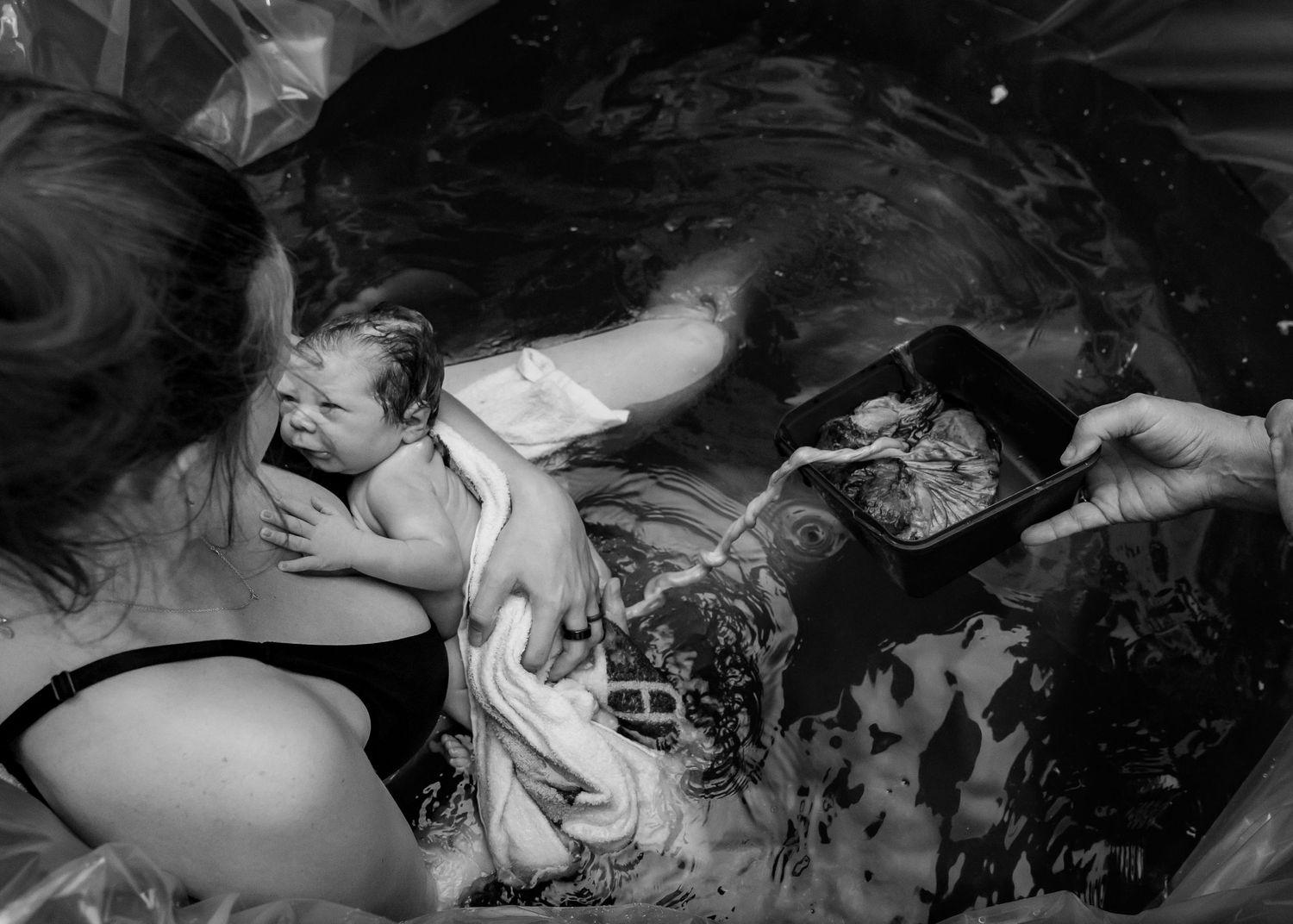 Home birth photography capturing baby's arrival