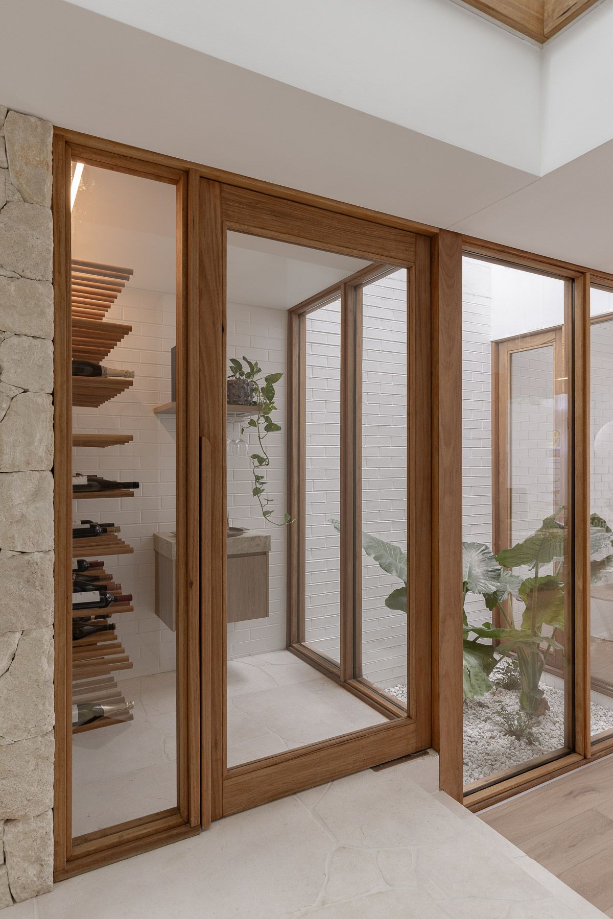 Interior and architectural photography of contemporary courtyard connection and timber framed glass in Miranda NSW.