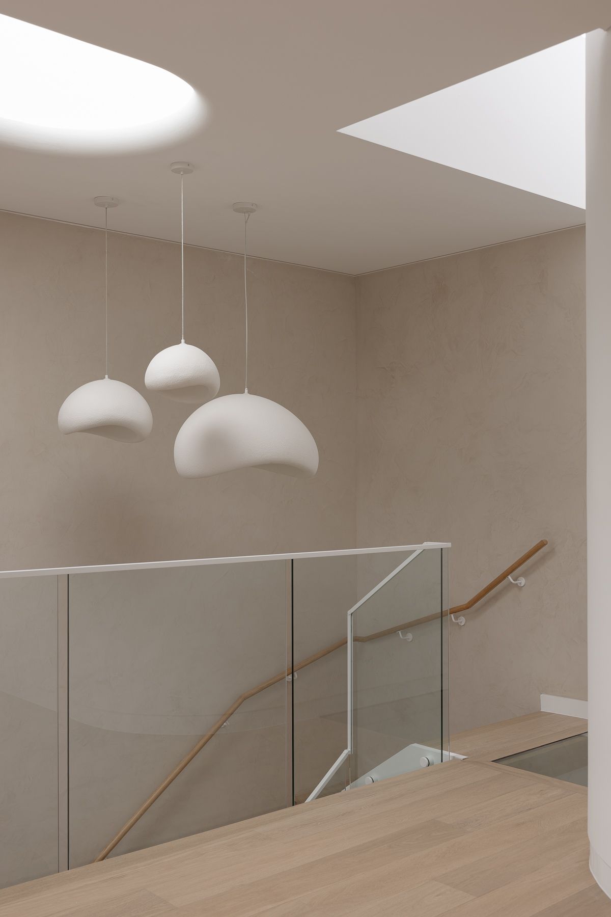 Interior photography of contemporary staircase and upper level architectural design in luxury Miranda duplex.