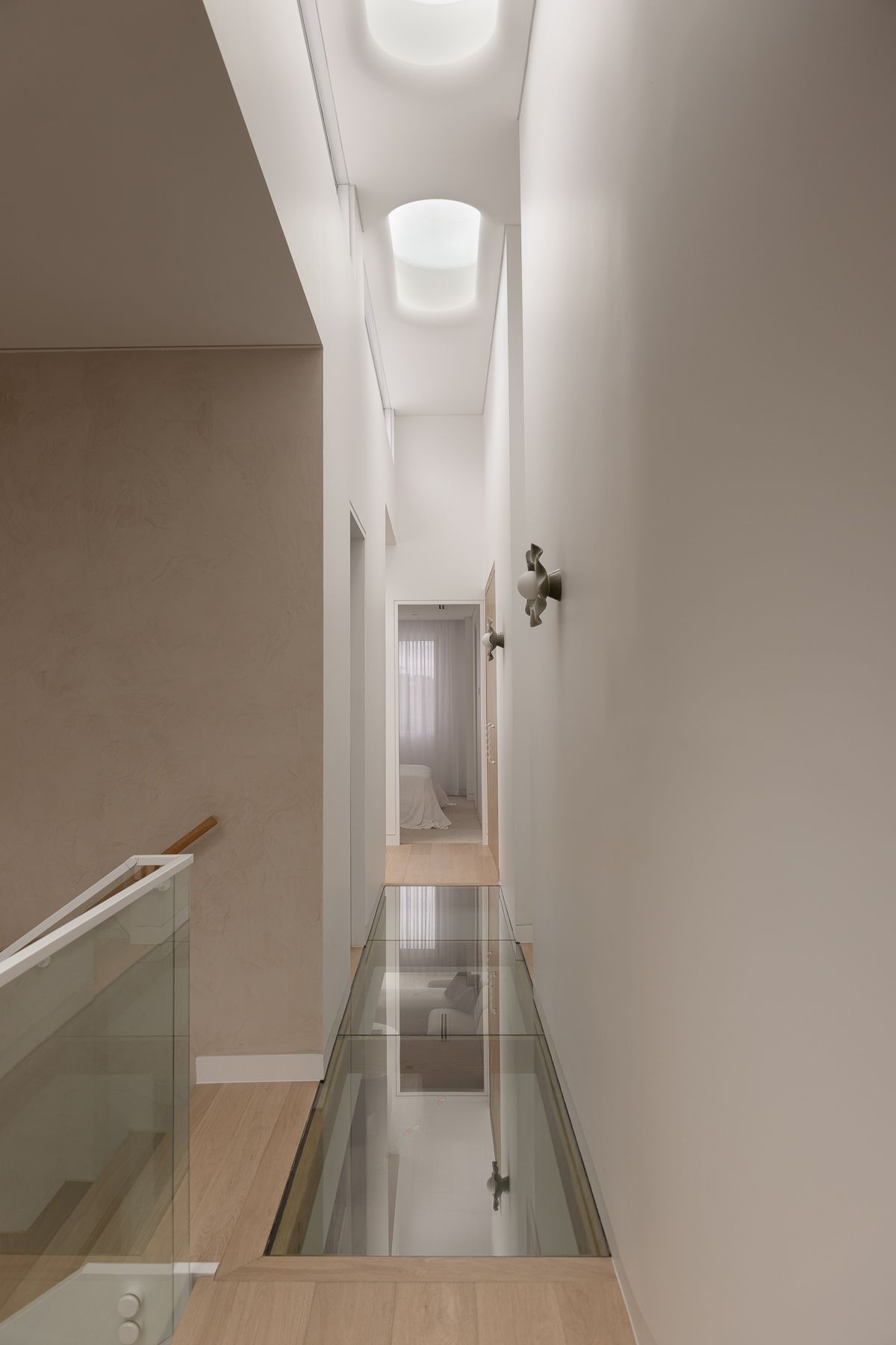 Architectural photography of modern residential staircase and upper hallway design in Miranda NSW.