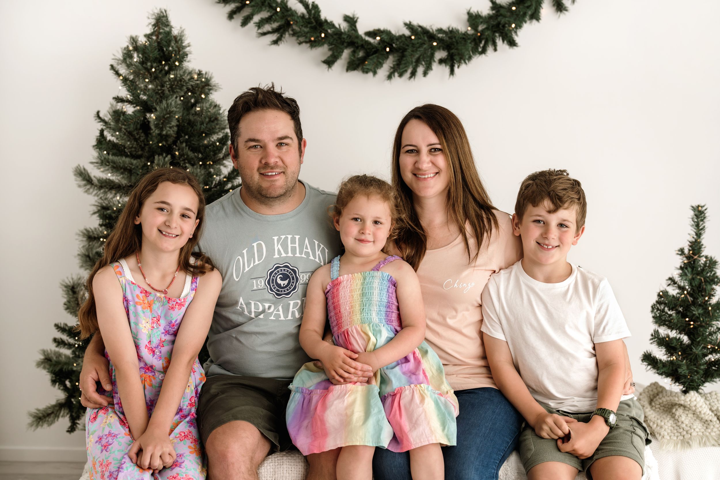 A collection of family holiday photos arranged in a row showing festive moments against white backgrounds.