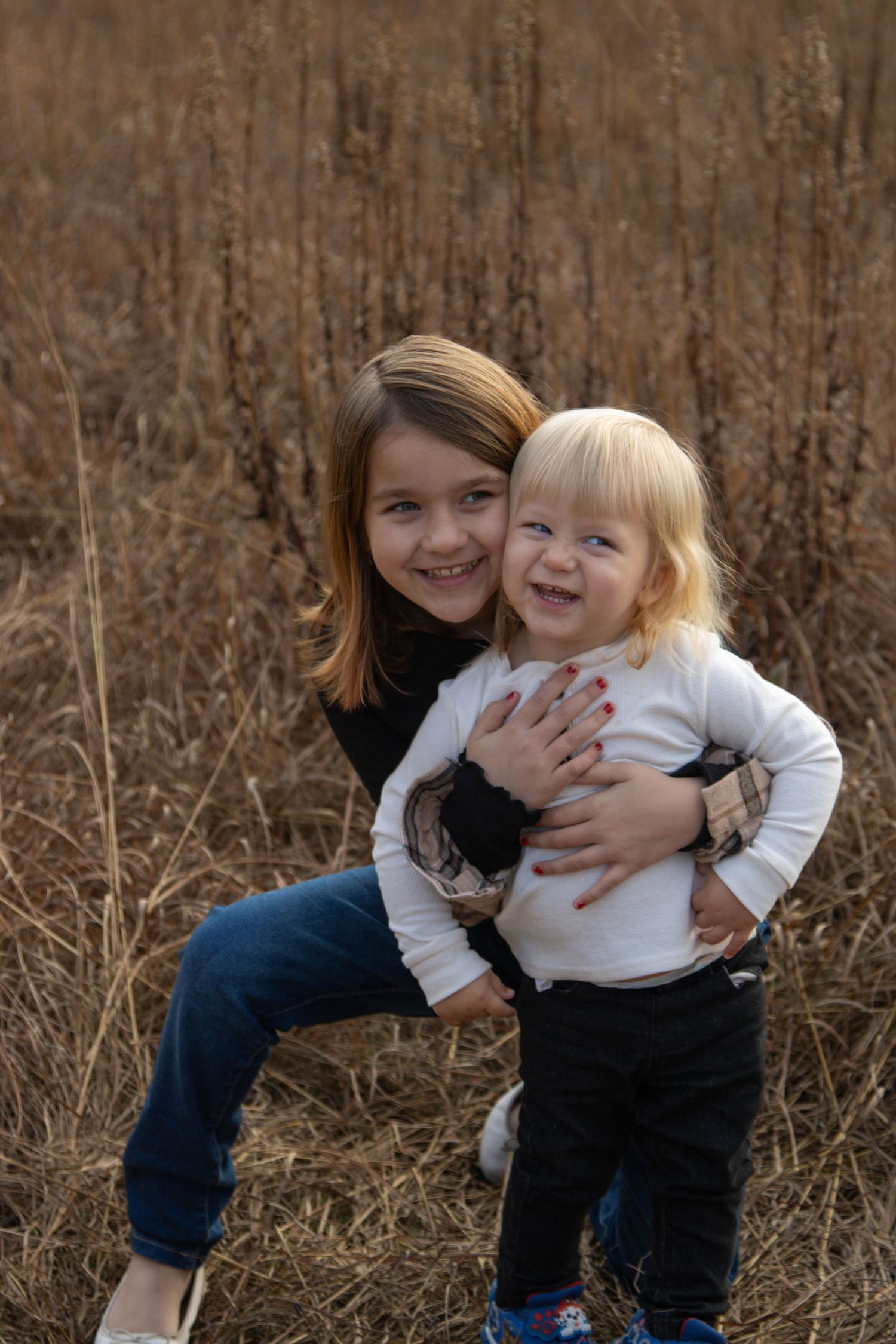 A sweet moment between parent and child outdoors in fall scenery.