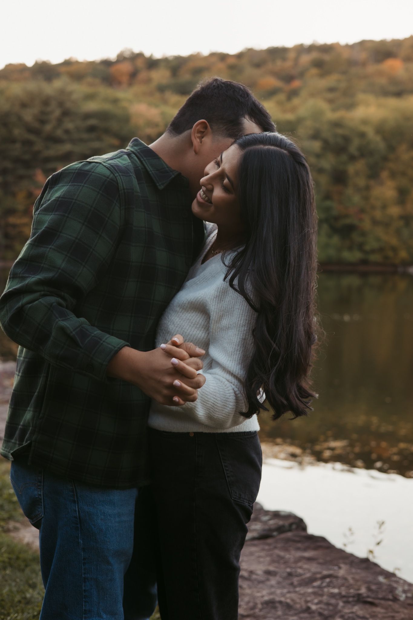 Engaged couple slow dancing on a lake in suffield, Ct for an engagement photoshoot