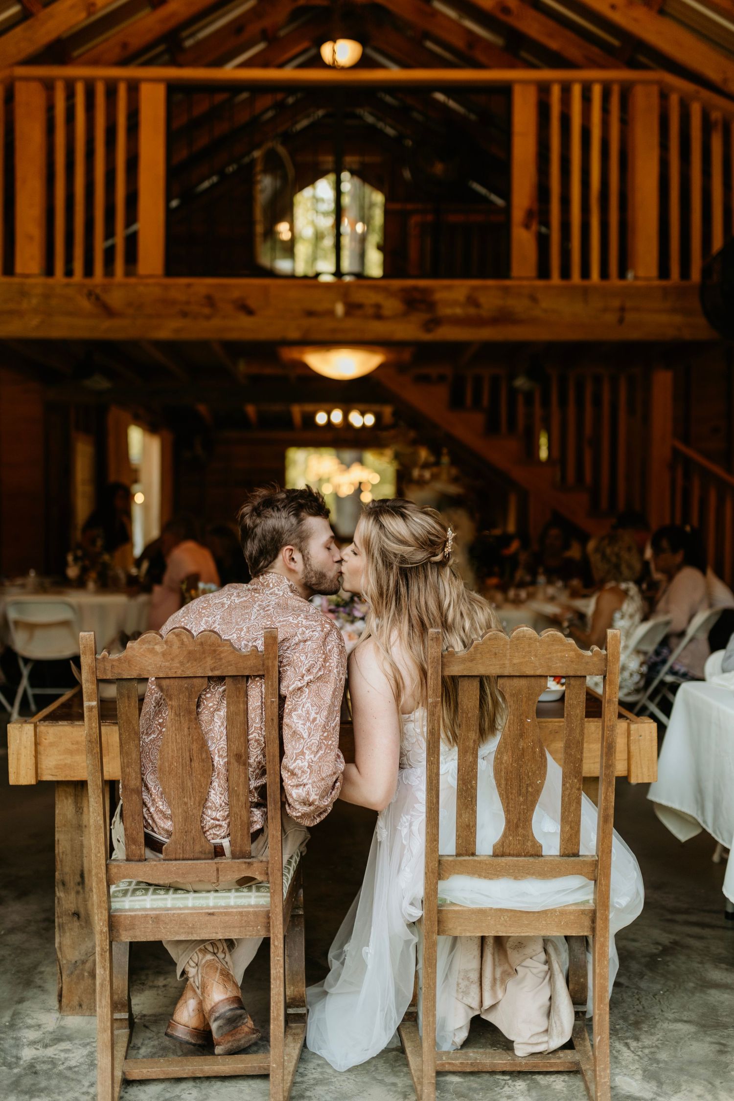 bride and groom at dinner at the barn at big oak