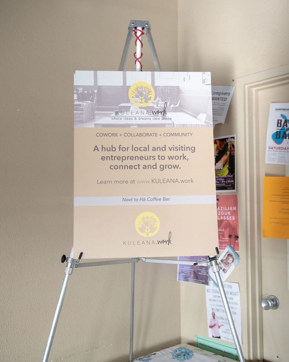 A promotional sign for a local entrepreneur hub mounted on an easel.