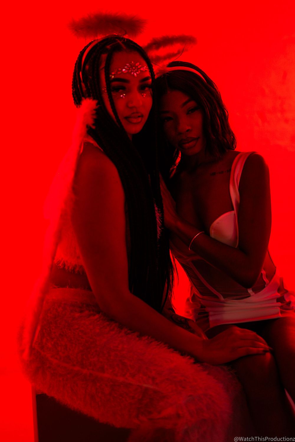 Red-tinted artistic photoshoot featuring dramatic shadows and silhouettes.