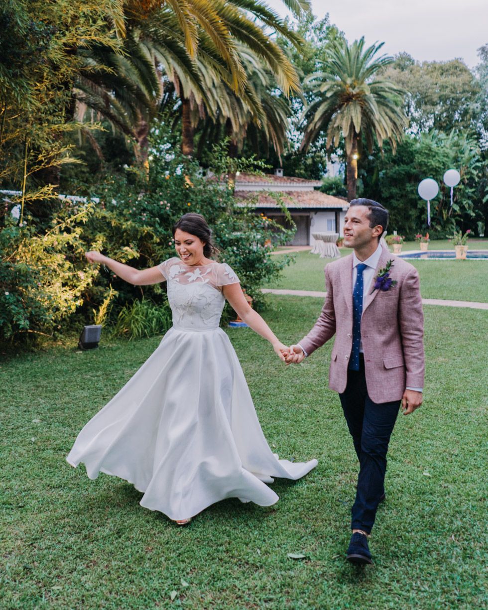 A romantic outdoor scene with palm trees and garden paths creating a beautiful natural setting.