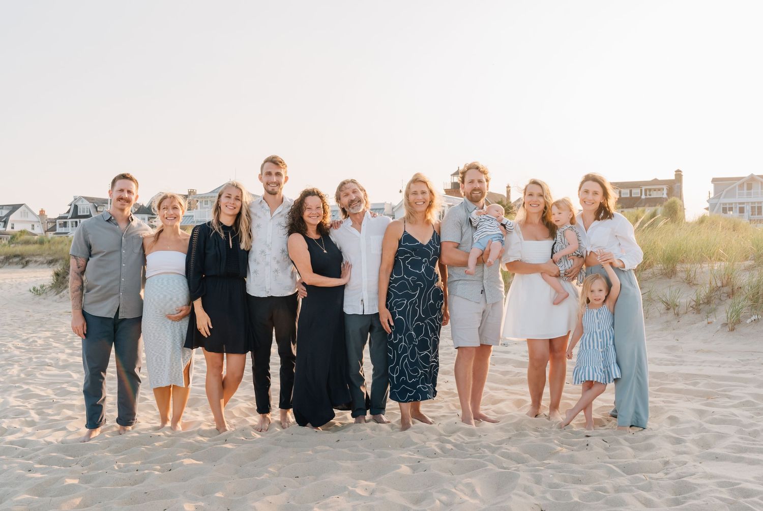 A group shot of an extended family on the beach in spring lake nj.