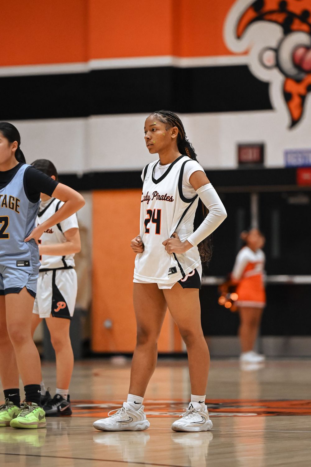 Basketball players line up on the court during game action.