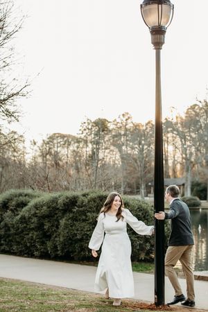 A playful sequence of photos along a lamp-lit pathway near a lake at sunset.