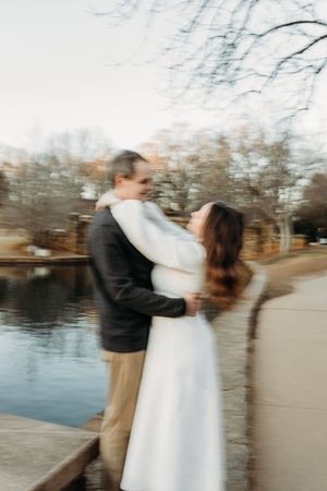 Dancing and twirling movements captured in a series of romantic lakeside photos.