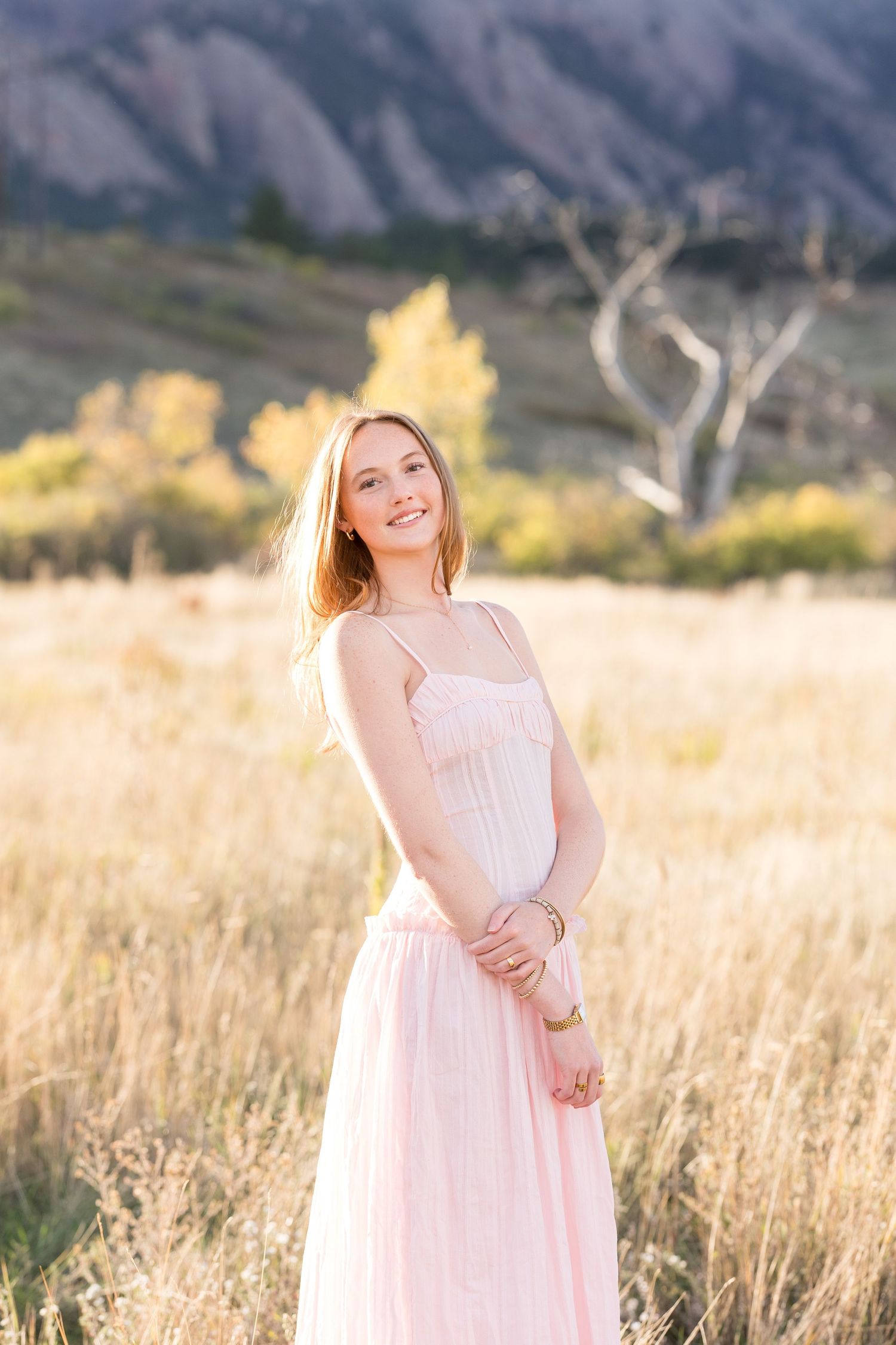 Casual outdoor portrait against red rock formations in natural lighting.