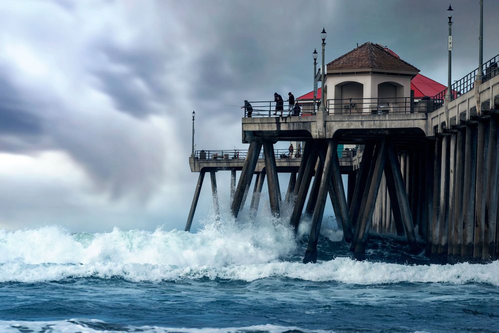 stormy waves batter the Huntington Beach Pier
