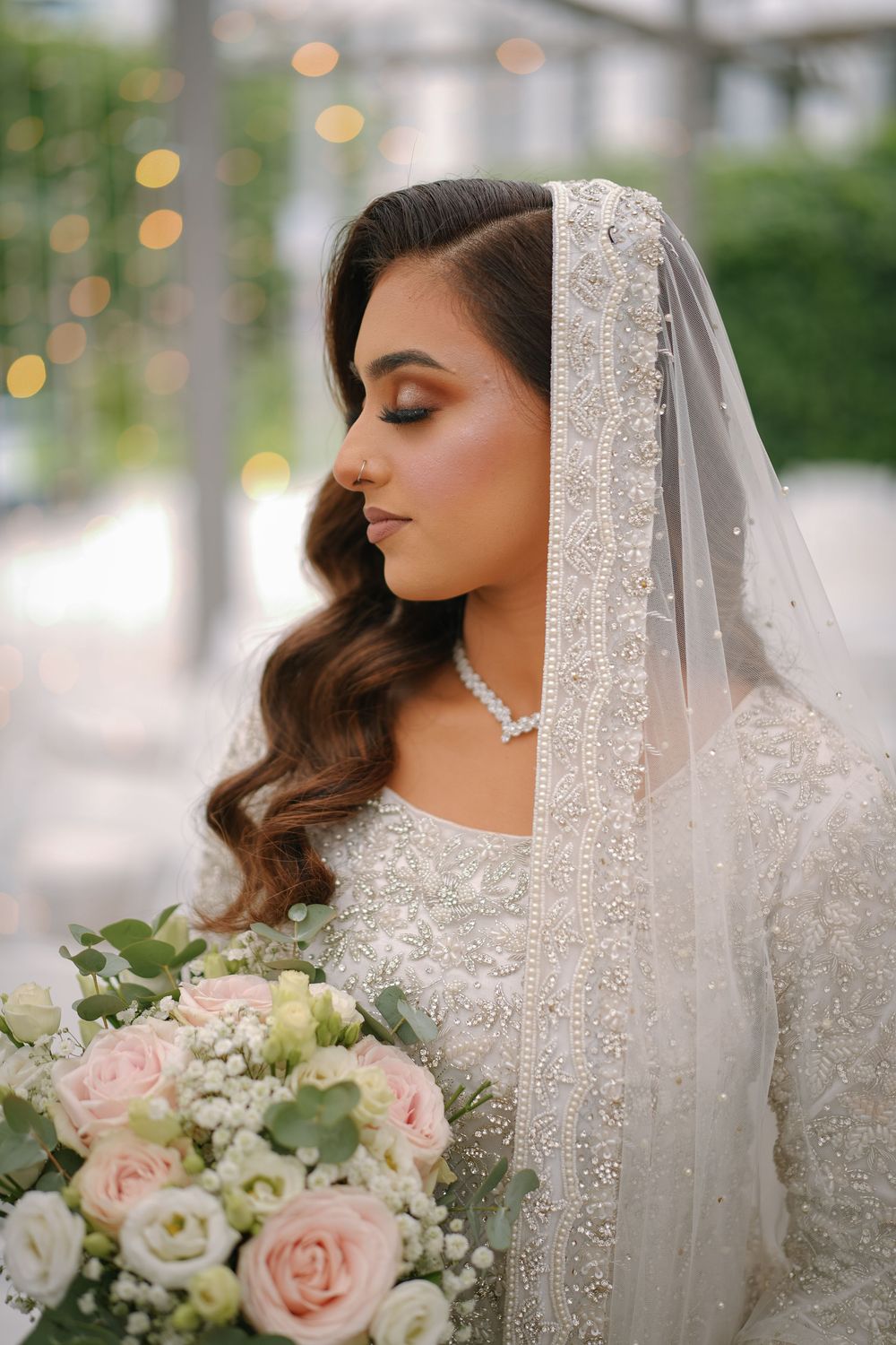 A collage of bridal portraits featuring a white embellished veil and delicate blush pink and white floral bouquet.