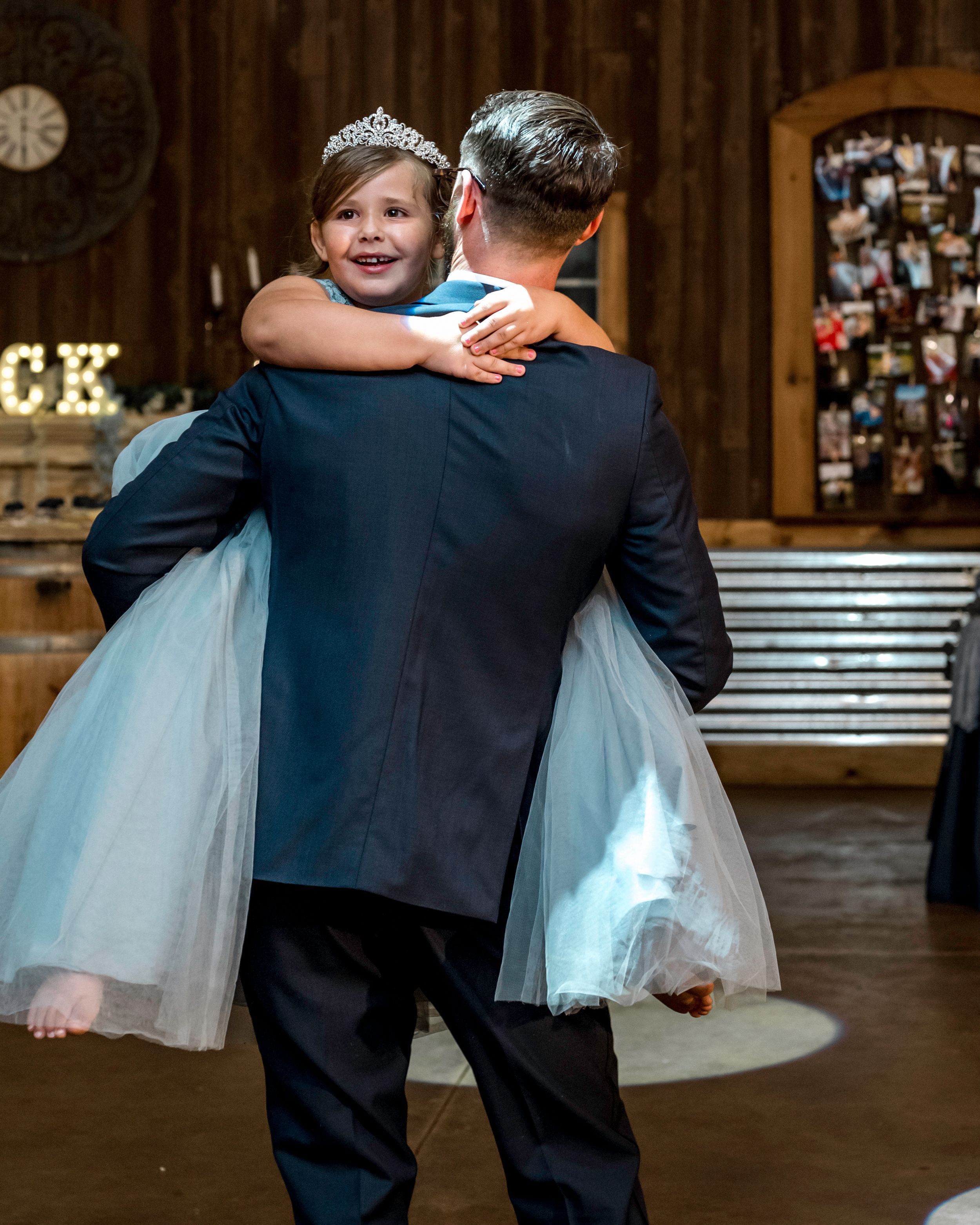 A special dance moment between two people at an indoor wedding reception.