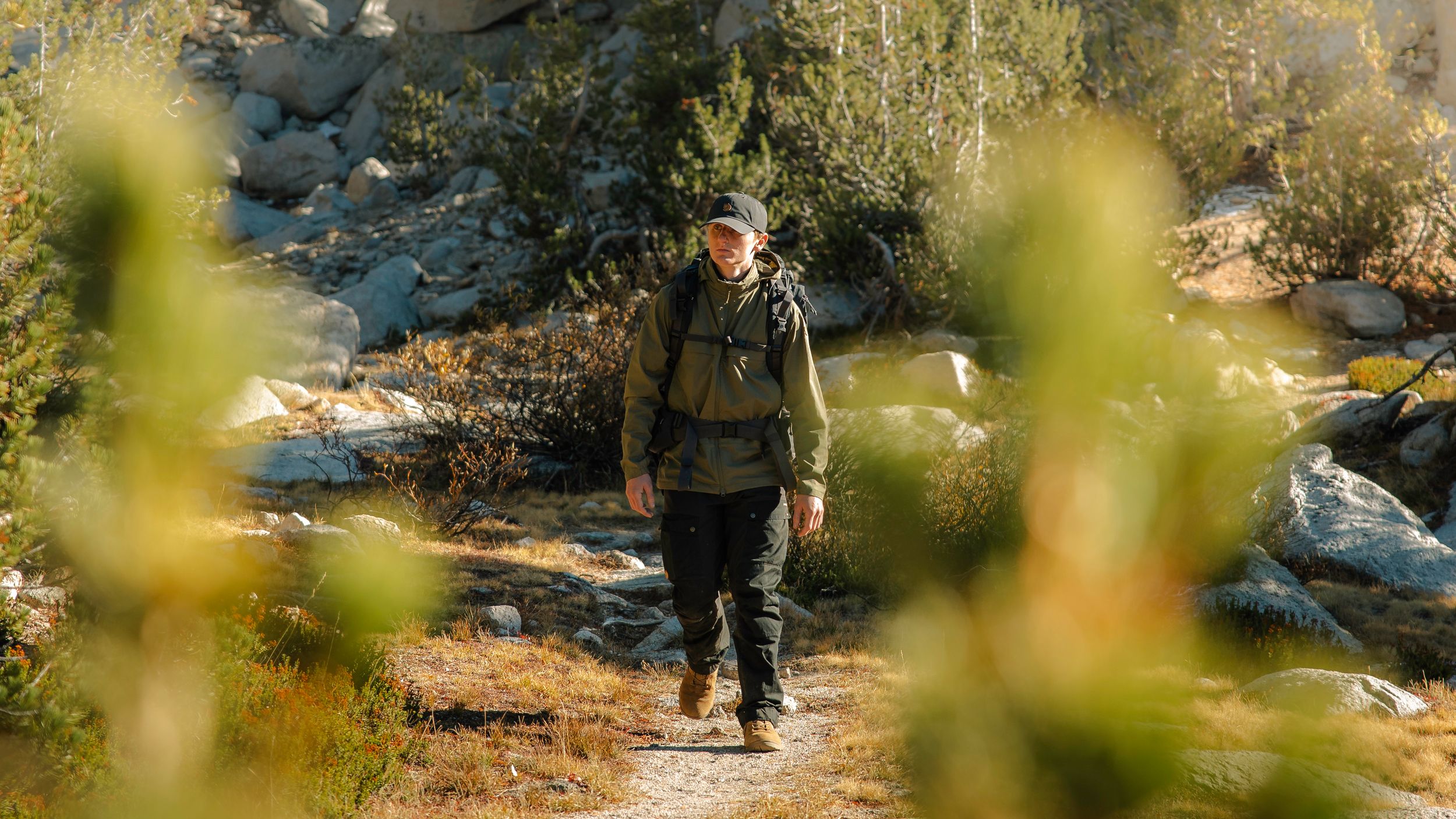 Fjallraven Backpacking Products at Alpine Lake - Vidda Hat, Abisko Hike Jacket, Keb Trousers, Kajka 65L