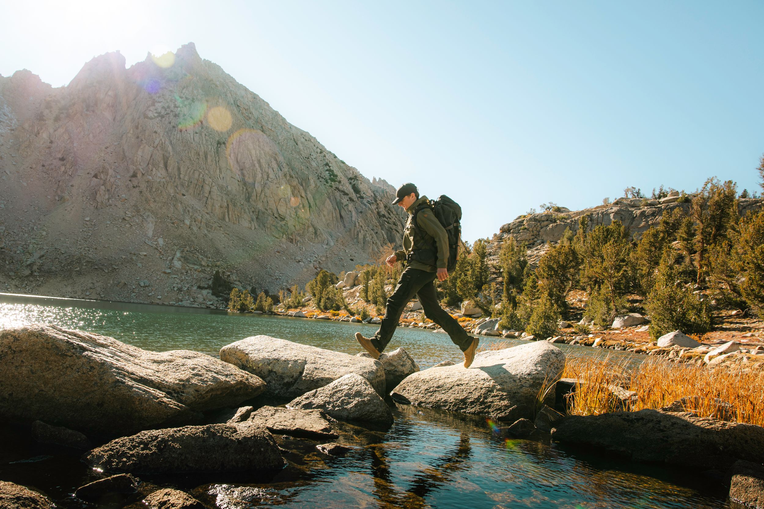 Fjallraven Backpacking Products at Alpine Lake - Vidda Hat, Abisko Hike Jacket, Keb Trousers, Kajka 65L