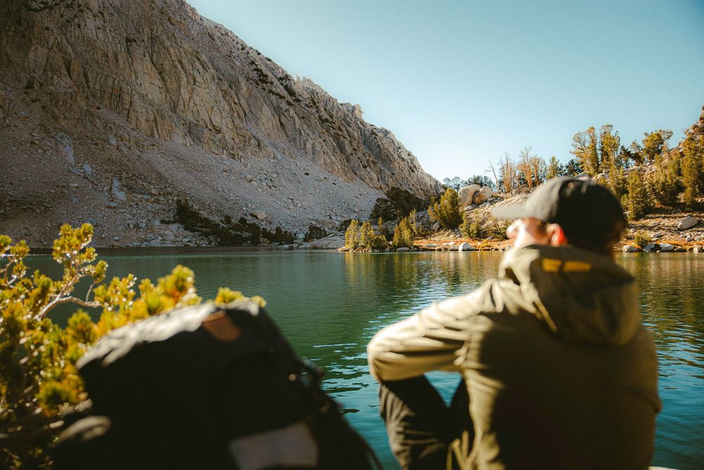 Fjallraven Backpacking Products at Alpine Lake - Vidda Hat, Abisko Hike Jacket, Keb Trousers, Kajka 65L