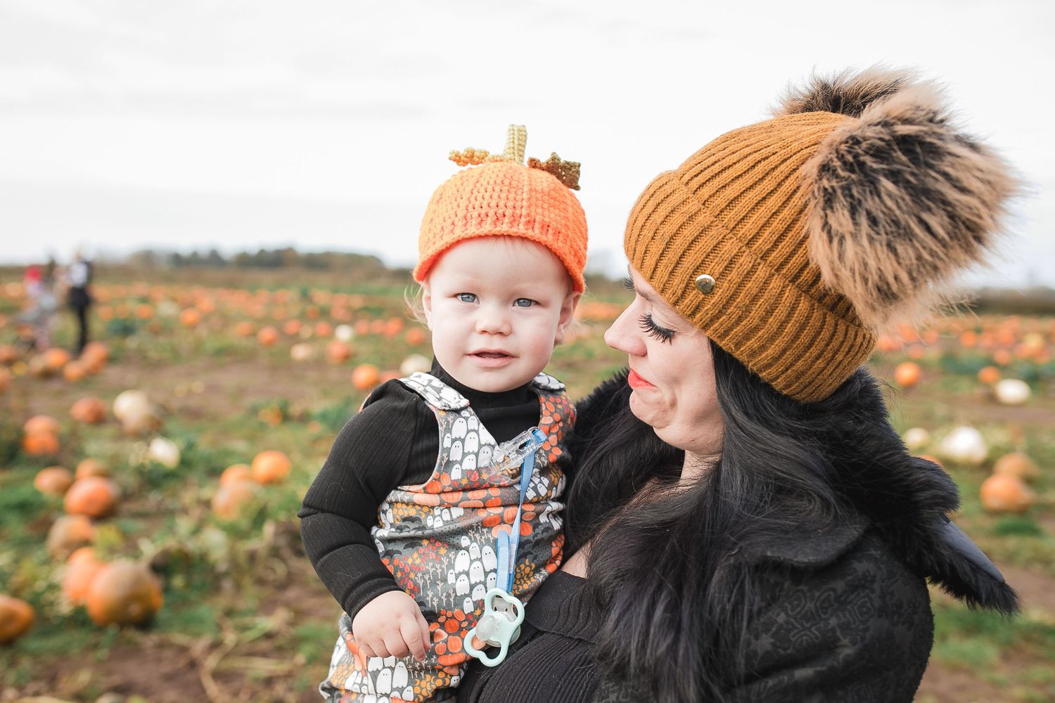 Fall pumpkin patch visit with orange and brown knit hats. Photographer. Hull. East Yorkshire. Photography
