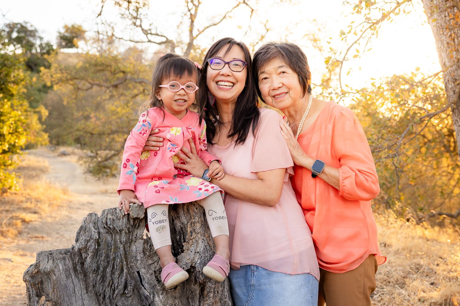 Three generations of women smile at golden hour photo shoot with Bay Area Photographer Cindy Tucey