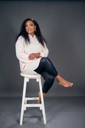 lady seating on a stool