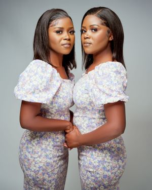 twins standing next to each other