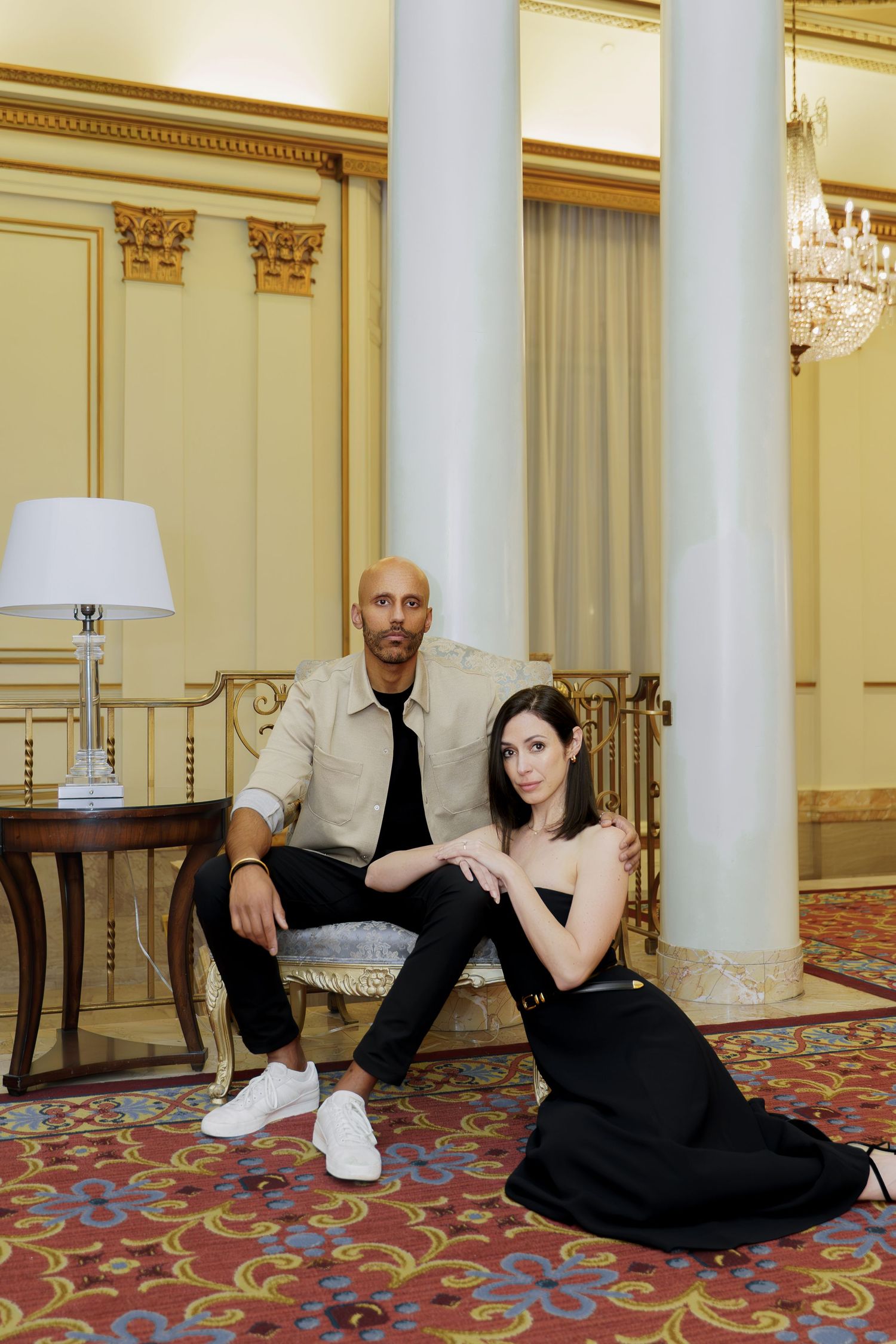 A series of four photos showing people lounging in elegant poses on a carpeted floor with ornate columns and decor.