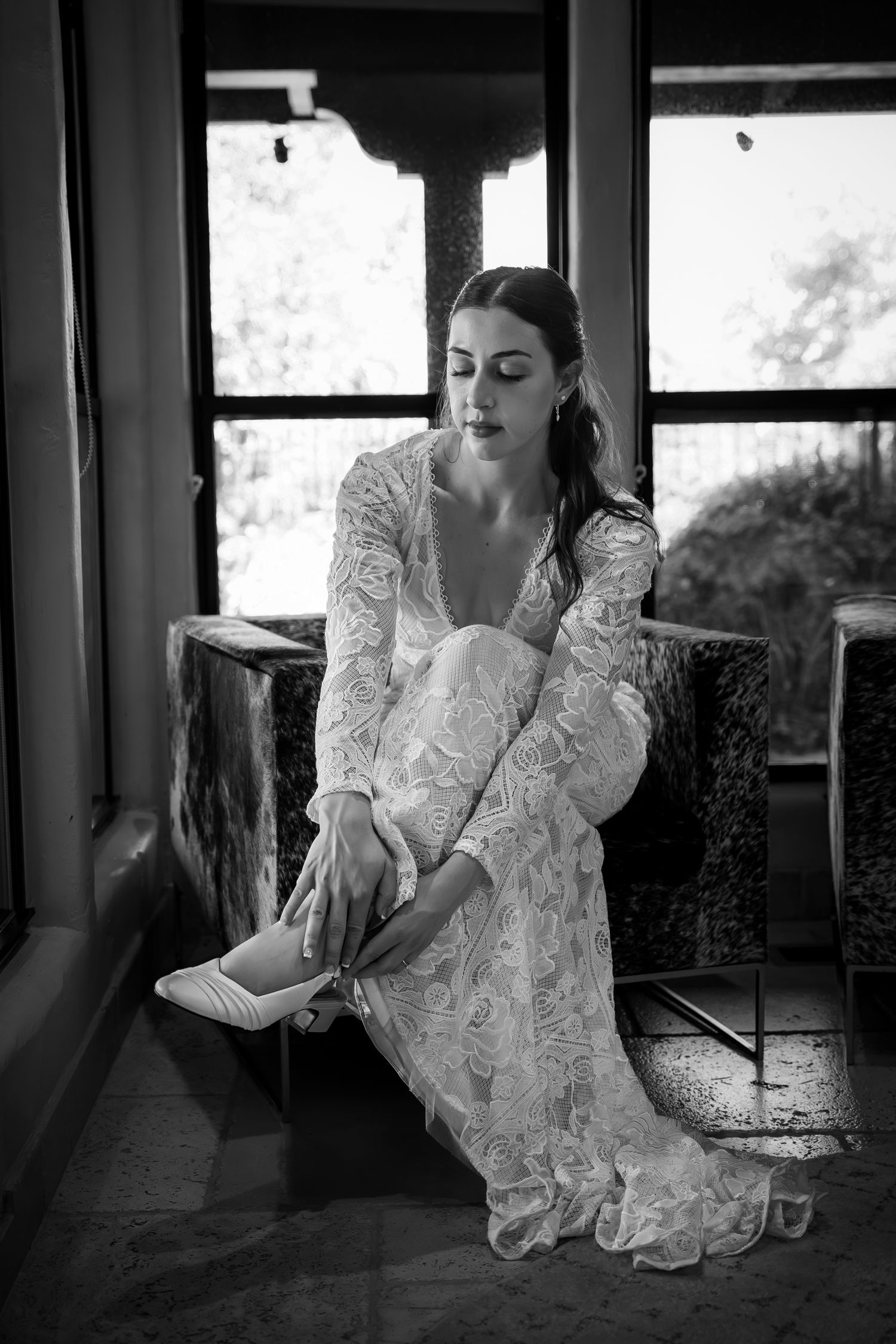 Photo of a bride getting ready before the wedding ceremony. Photo by Sacramento Wedding Photographer, Ashley Nicole Baeza.