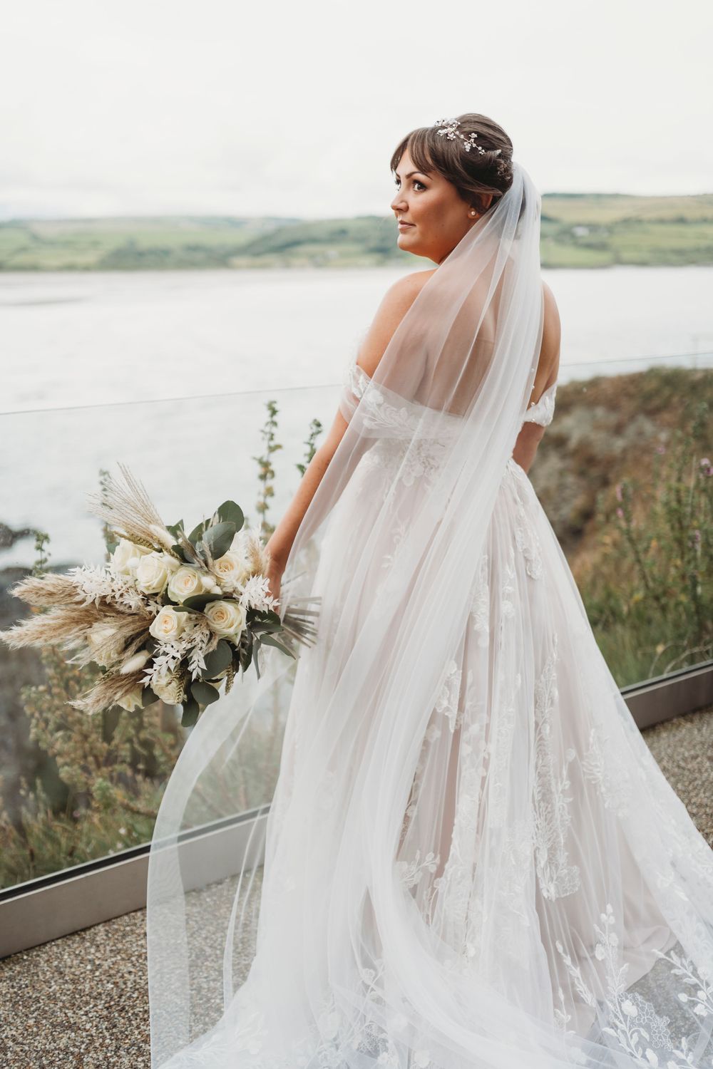 Bride overlooking Cardigan Bay during relaxed Ceredigion West Wales wedding