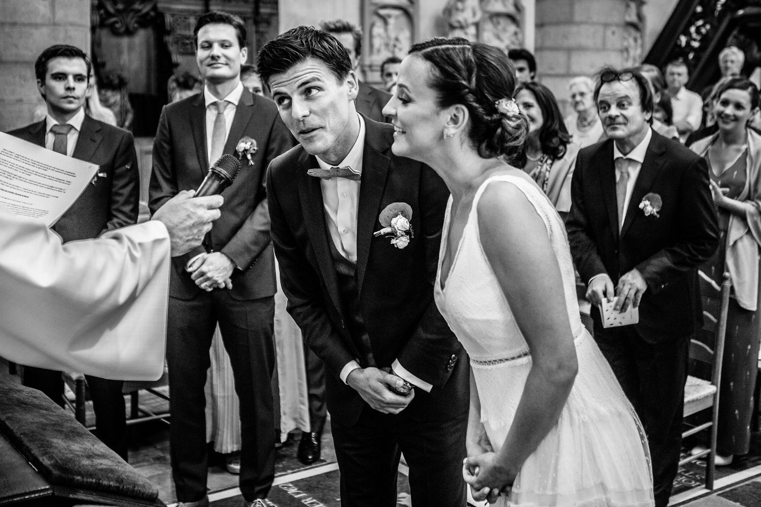 Wedding party celebrates with enthusiasm during a joyous outdoor reception.