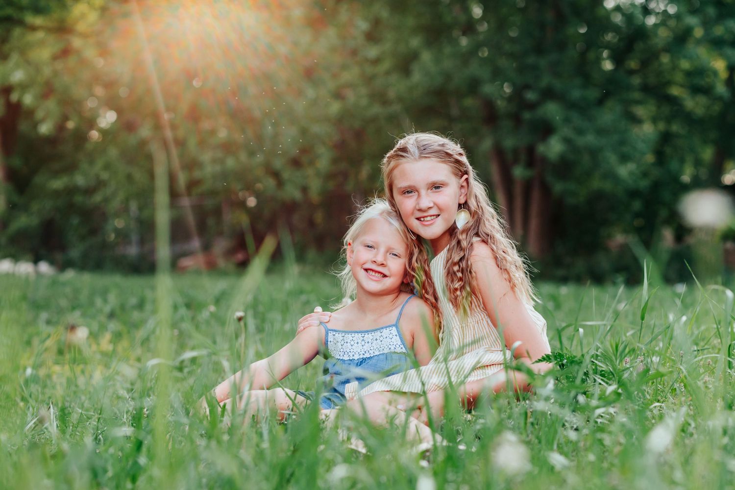 People relaxing together in a lush green meadow on a sunny summer day.