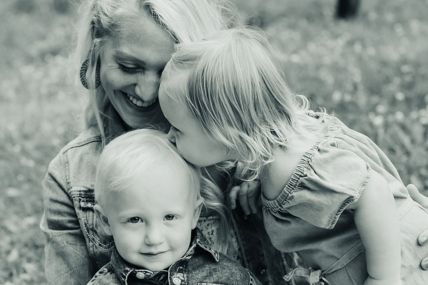 Black and white intimate family portrait series showing tender moments.