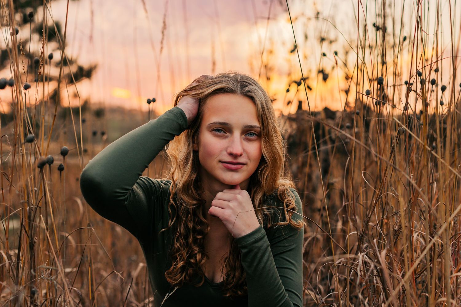 Artistic portrait series in tall grass during golden sunset hour.