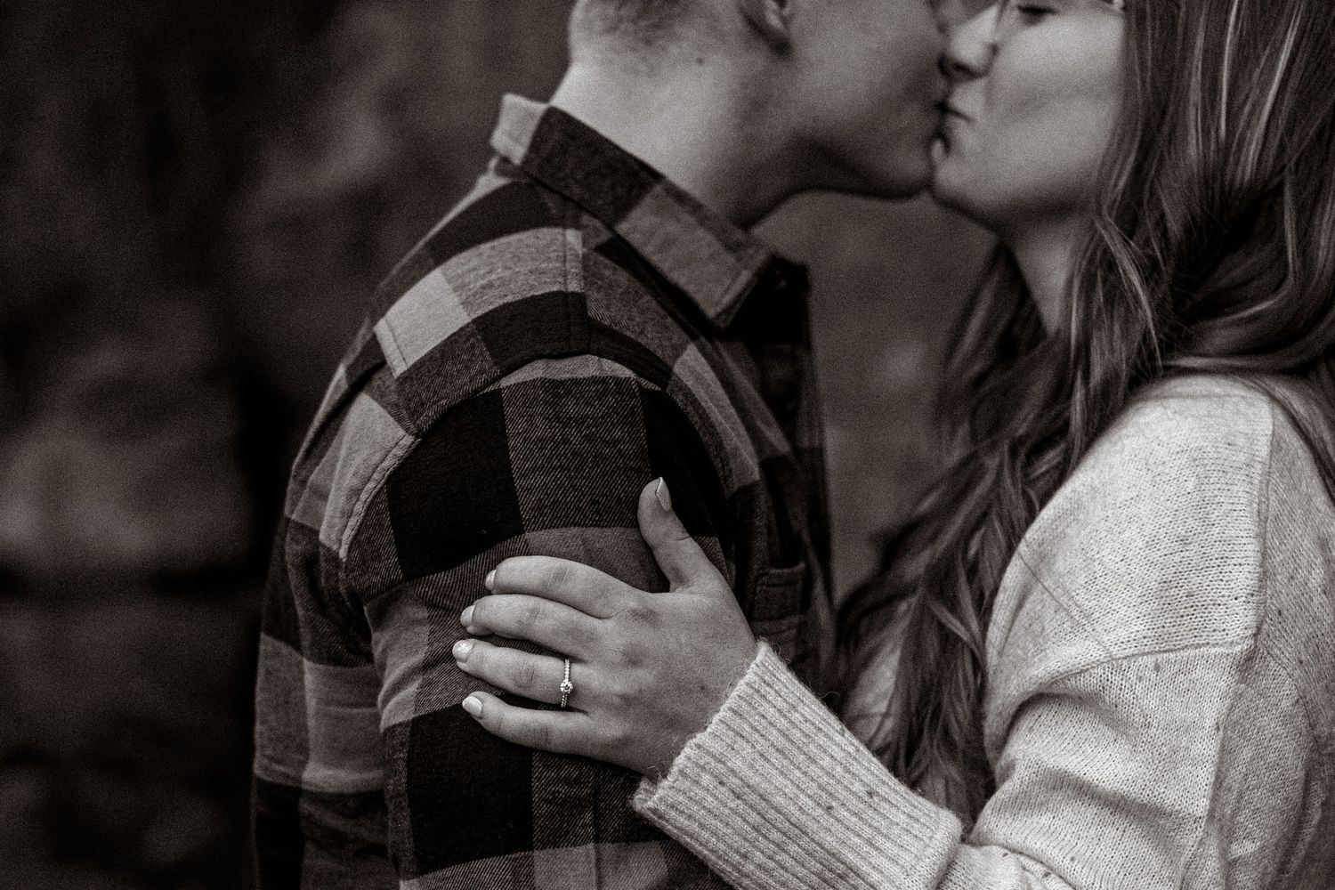 Collection of intimate black and white photos showing affectionate moments.