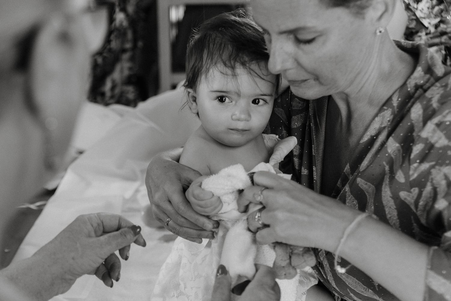 Family posing during christening photography in Cyprus.