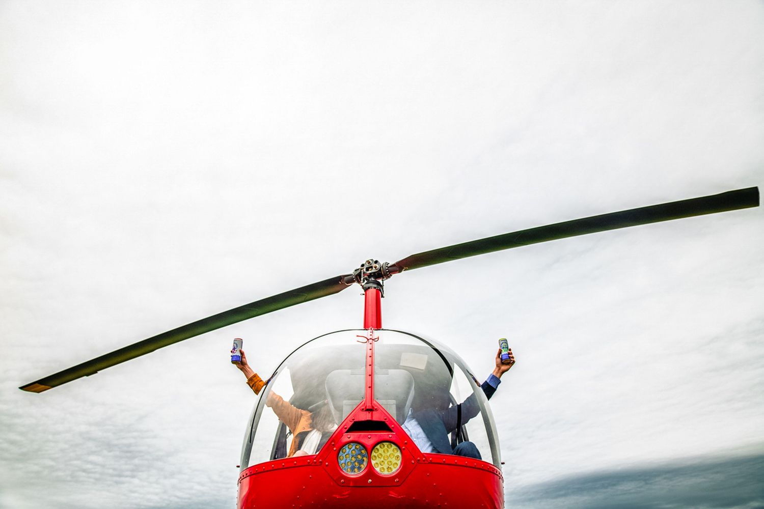 Adventure engagement shoot with couple riding a helicopter in Middletown Rhode Island captured by Stefy Hilmer Photography