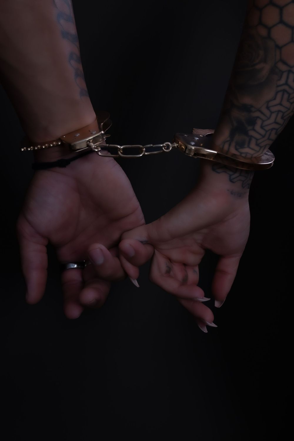 Close-up sequence of hands wearing silver bracelets and rings showing different angles and positions.