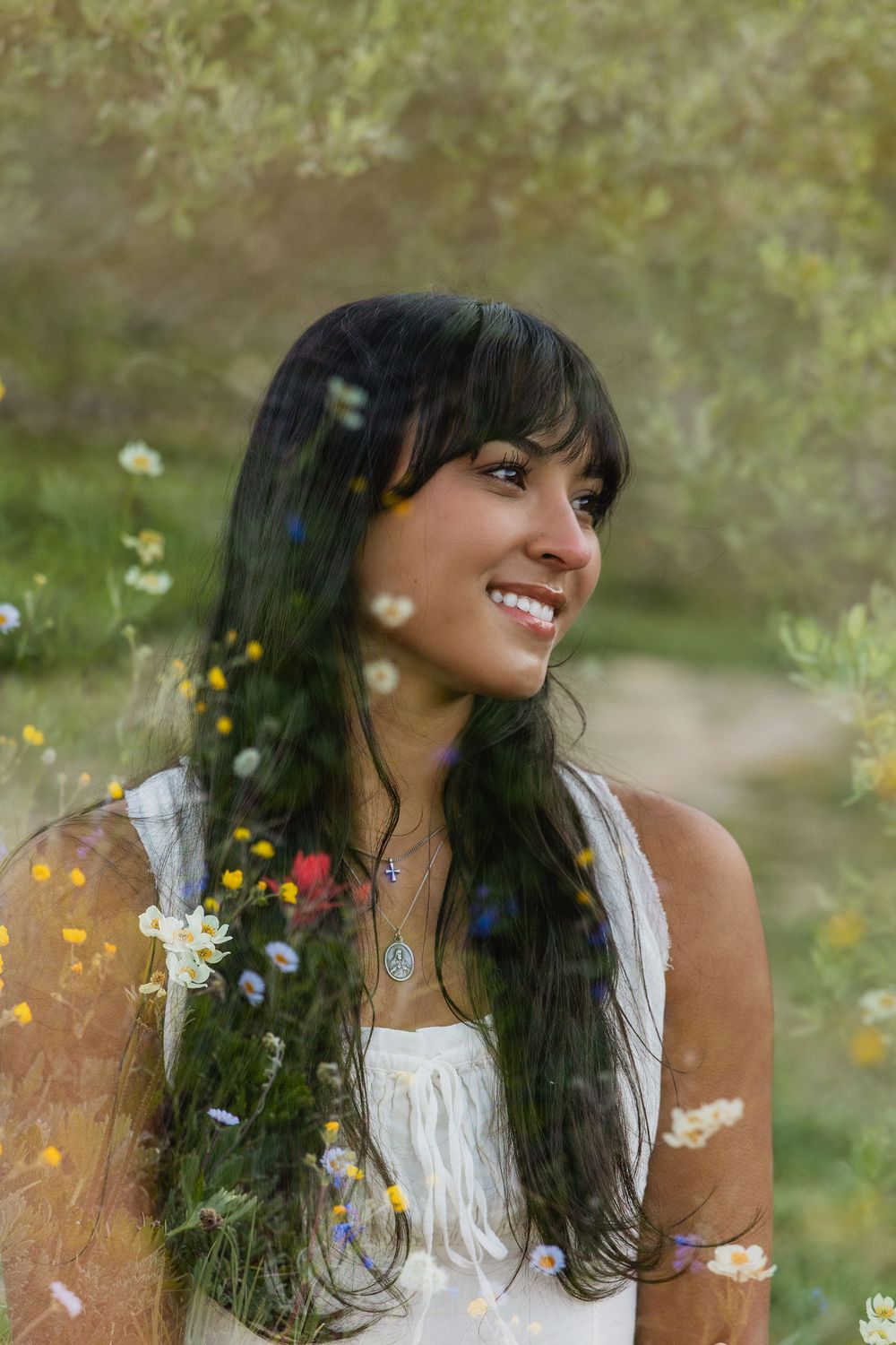 A series of candid outdoor portraits showing joyful expressions amidst blooming wildflowers and natural sunlight.