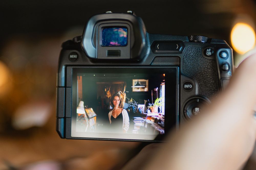 Close-up view of a camera viewfinder showing a digital display with focus points and exposure settings.