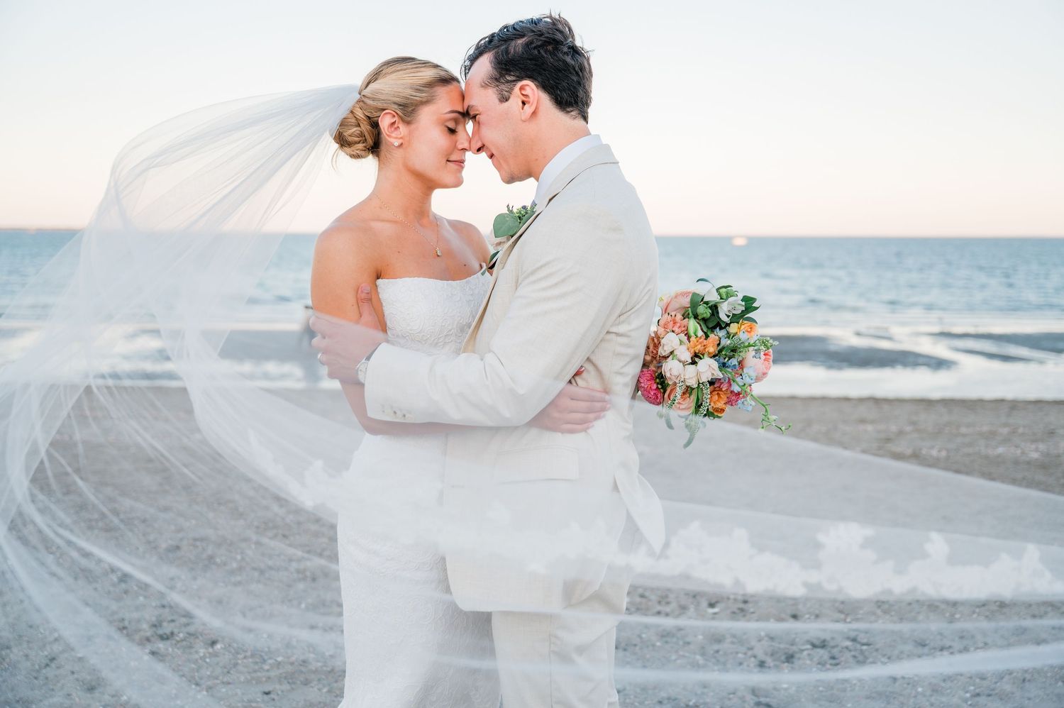 A romantic beach wedding photo collage showing couples embracing on a sandy shore at sunset.