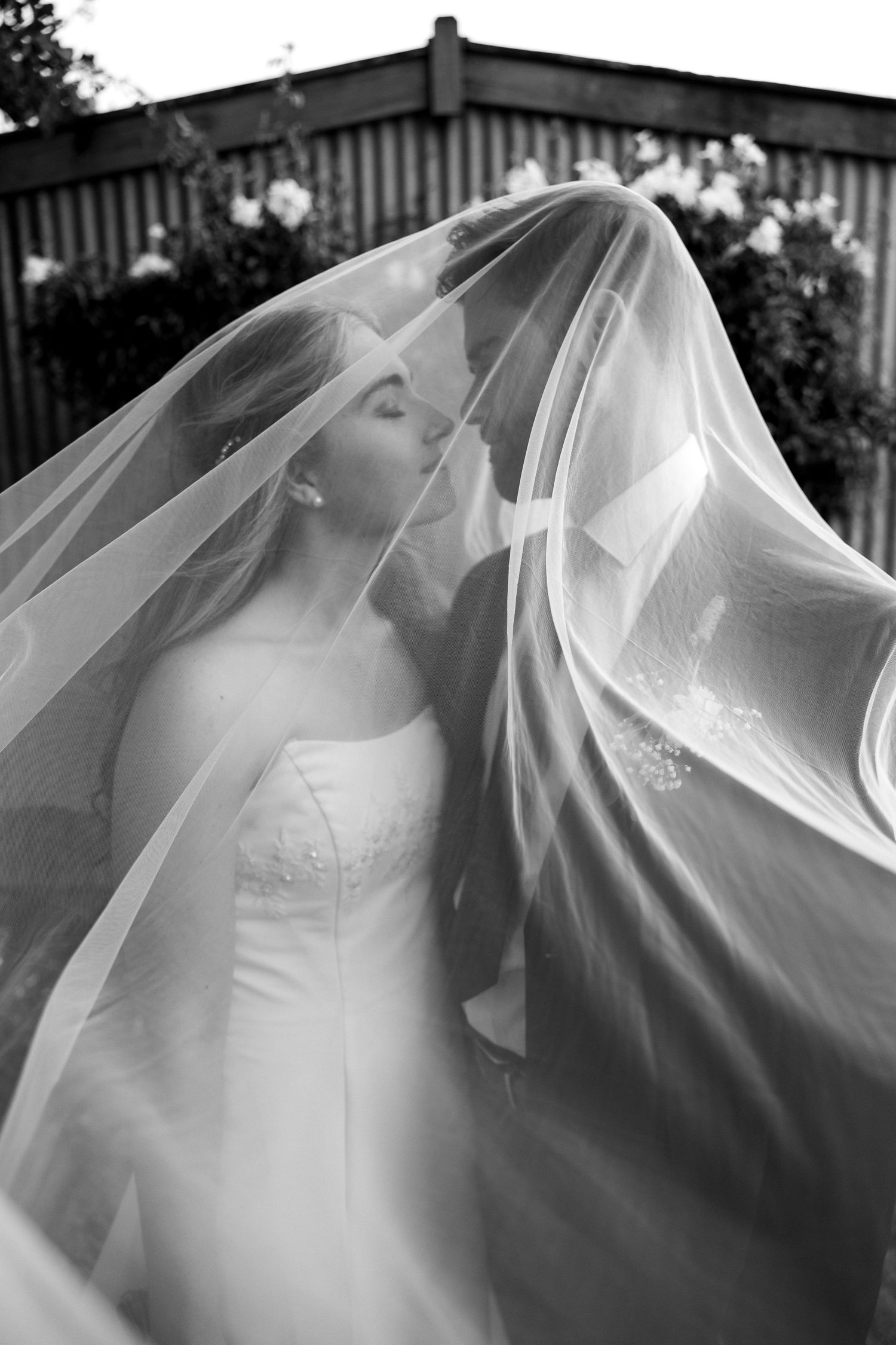 Flowing white wedding veil fabric captured in dramatic black and white. Auckland Wedding Photographer and videographer