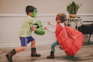A sequence of images shows a person in a green mask and another in red performing playful martial arts moves.