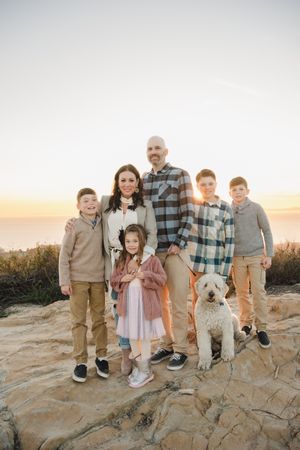 family on top of a canyon overlooking the ocean of southern california