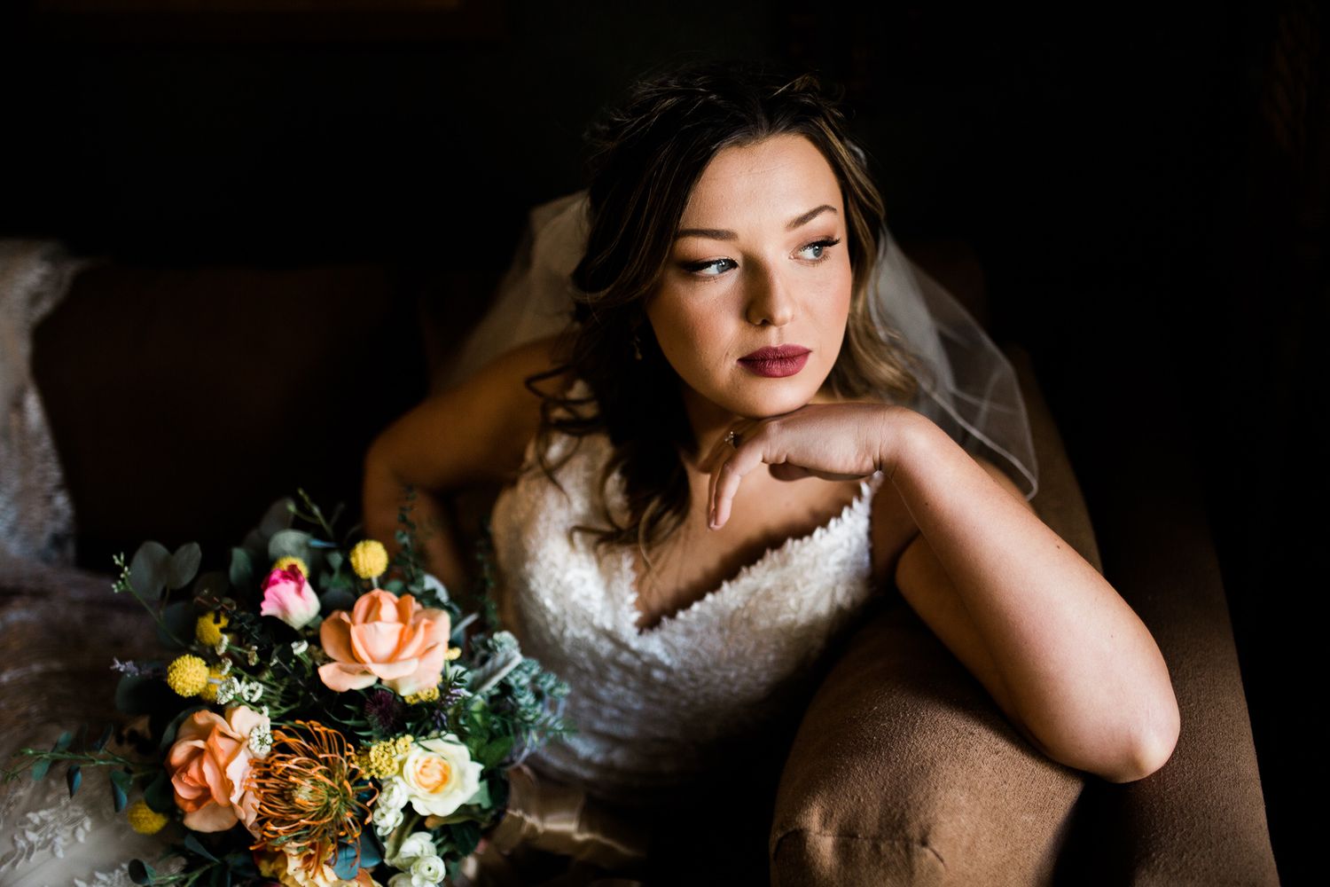 A series of romantic wedding photos featuring floral arrangements and soft lighting set in a moody atmosphere.