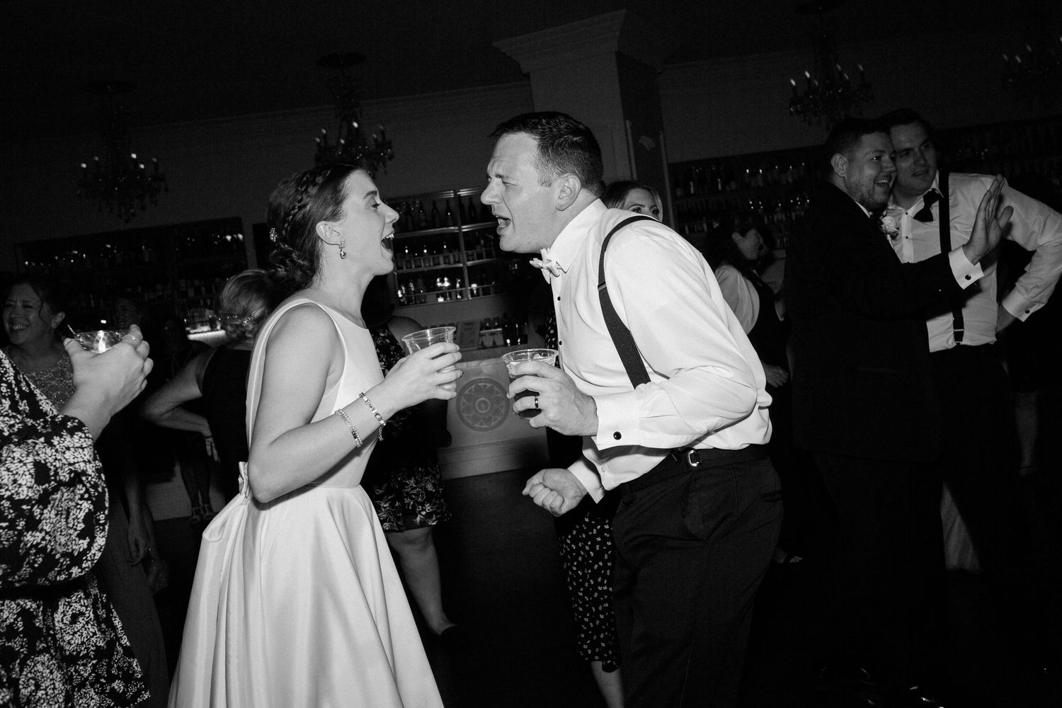 Black and white photos show people dancing and socializing at what appears to be a lively party or nightclub event.
