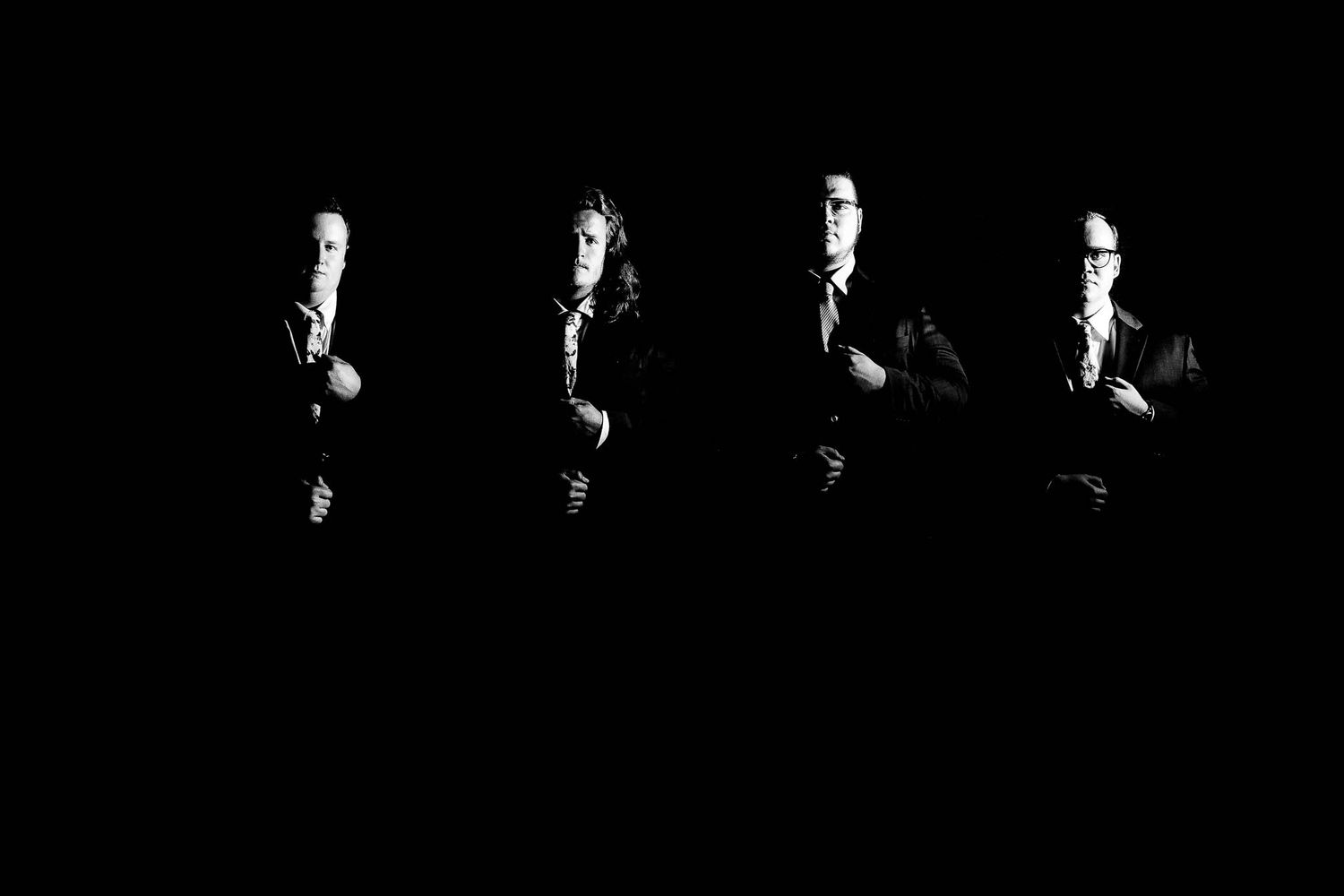 Seven birds in silhouette fly against a black background in a progressive sequence showing their motion.