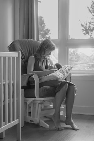 A sequence of grayscale photos showing a person doubled over in despair on a chair by a window.