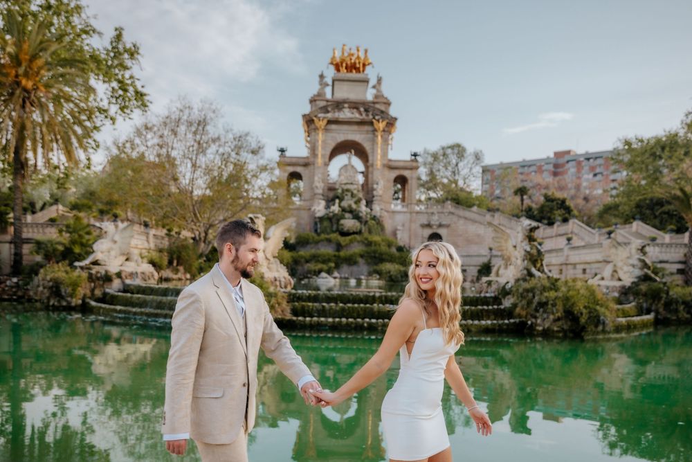 romantic scene of Ashley & Alex celebrating their honeymoon outdoors.