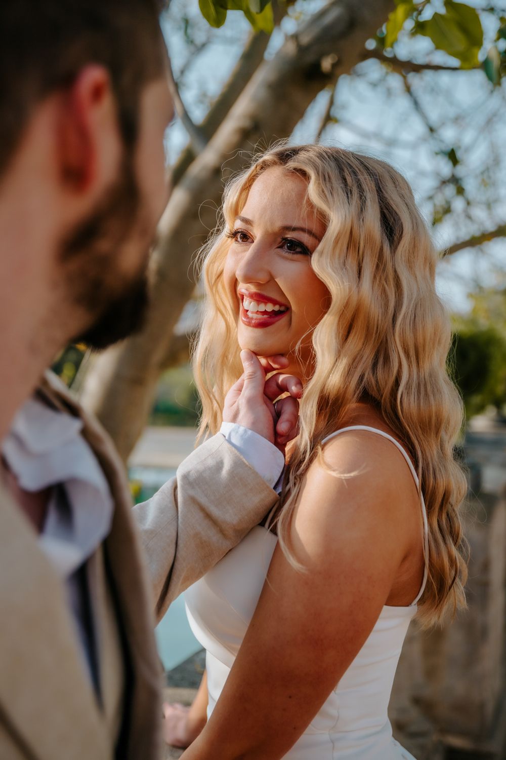 Playful candid moments of the couple enjoying their session in the park.